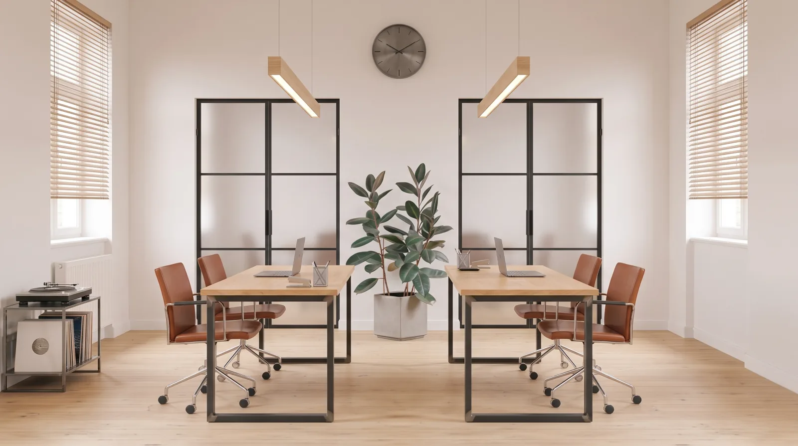 The studio: two desks, glazed partitions, daylight from both sides